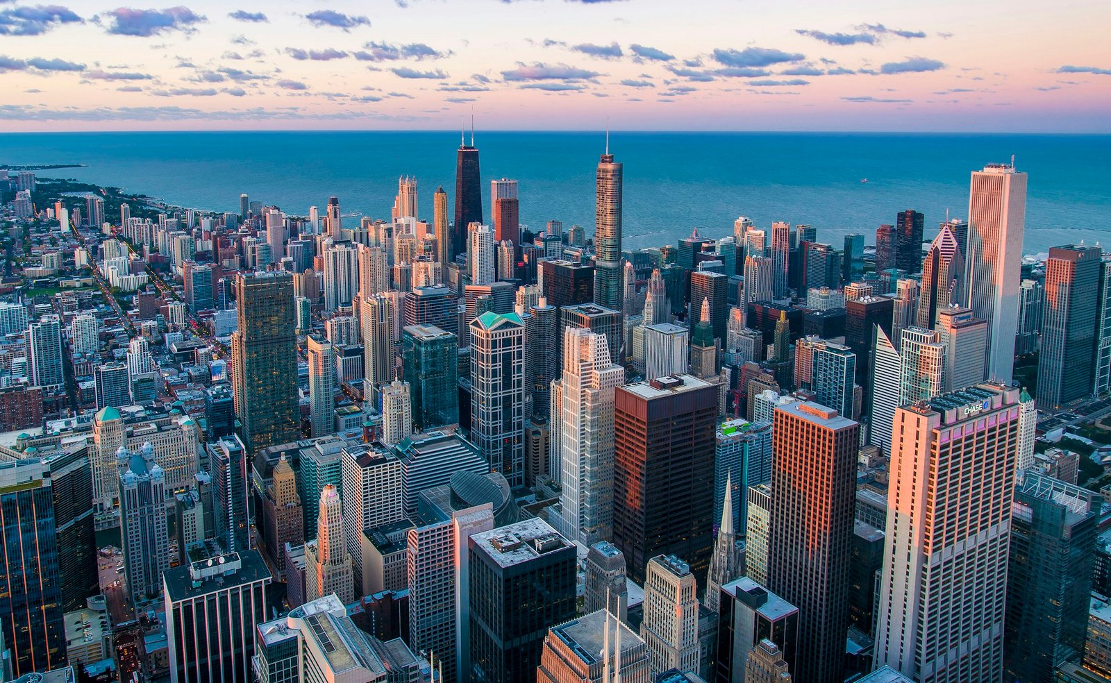City skyline at dusk with layered urban fabric